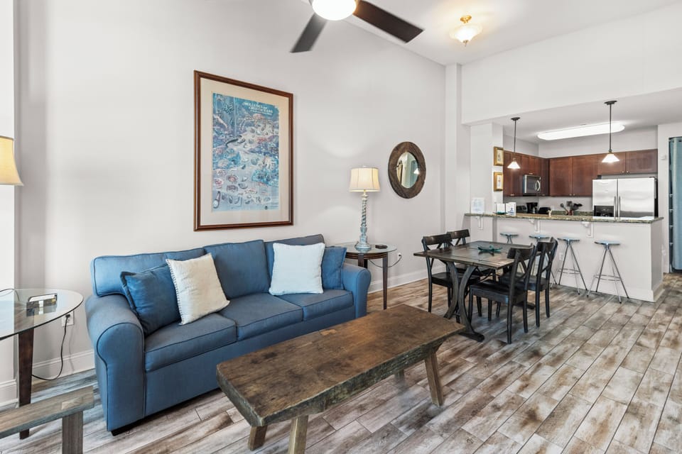 Relax in your stylish open-concept retreat where coastal blues meet modern comfort, perfectly connecting your living and dining spaces.