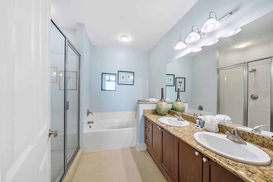 Your spacious bathroom features dual sinks and a relaxing soaking tub, perfect for unwinding after exploring.