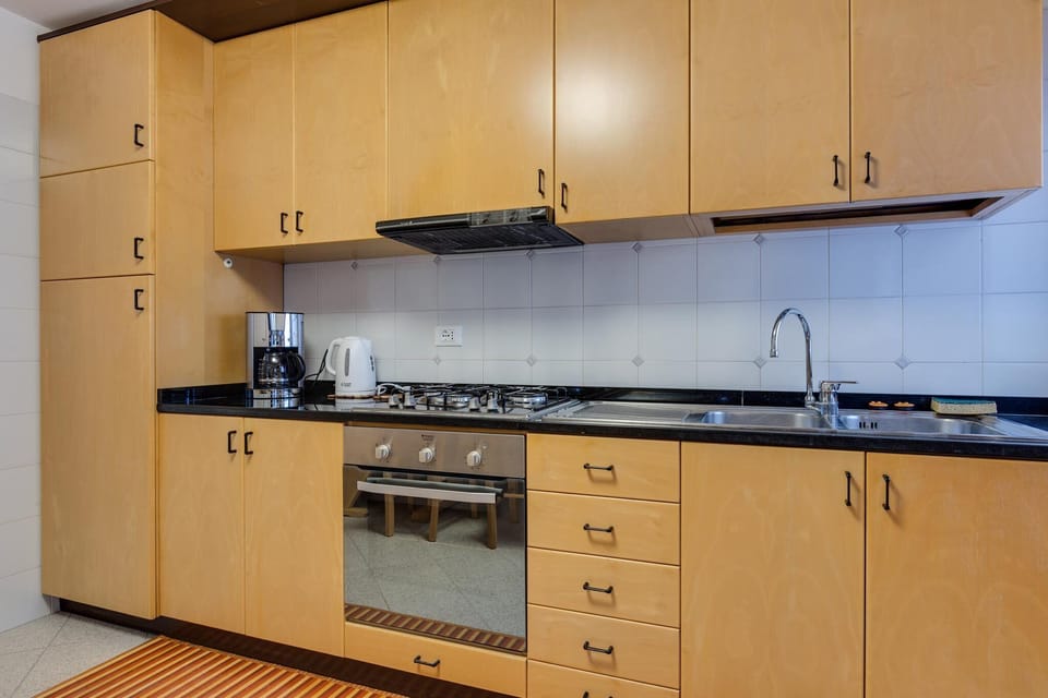 Apartment, 3 Bedrooms | Private kitchen | Full-size fridge, microwave, oven, stovetop