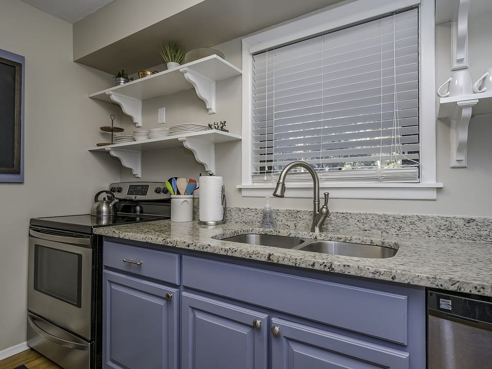 Updated kitchen with new stainless appliances and large window over the sink