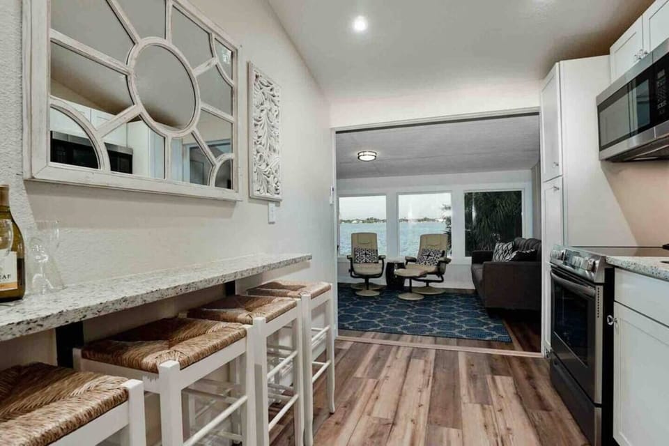 Granite breakfast bar is perfect spot for morning joe and Bay Views