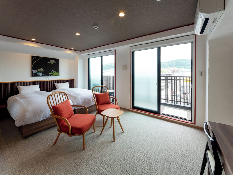 Executive Twin Room (Women or Couple Only) | In-room safe, desk, blackout drapes, iron/ironing board