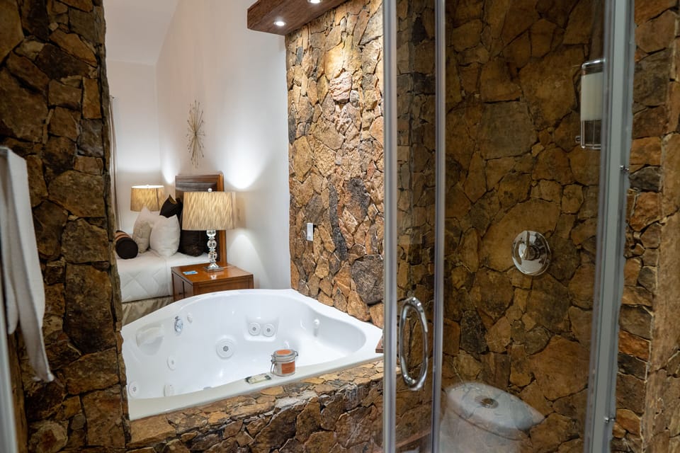 Luxury Room, Hot Tub, Mountain View | Bathroom | Shower, towels, soap, shampoo