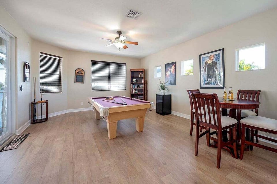 Upstairs Game Room with TV and Balcony
