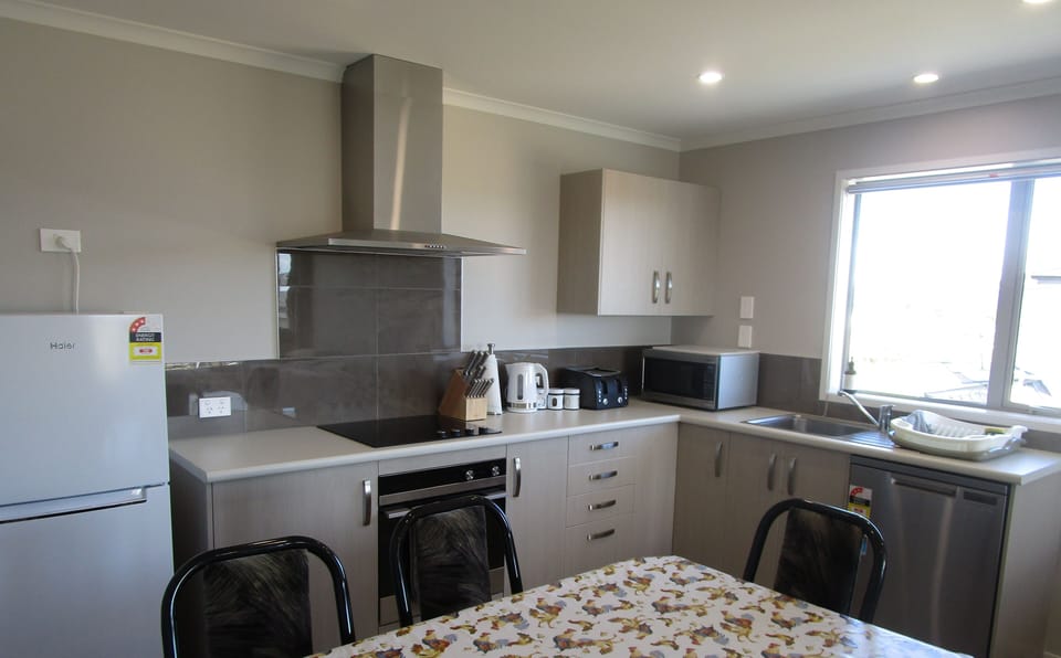 Full kitchen with stove, oven and even a dishwasher. Plus a full size fridge.