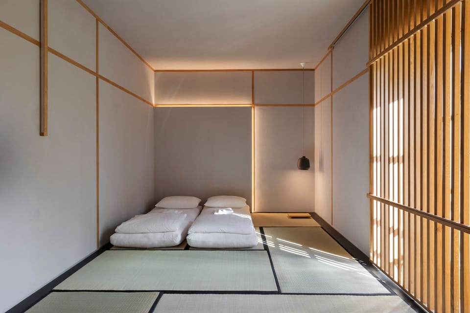 Japanese Family Room | Down comforters, desk, laptop workspace, blackout drapes