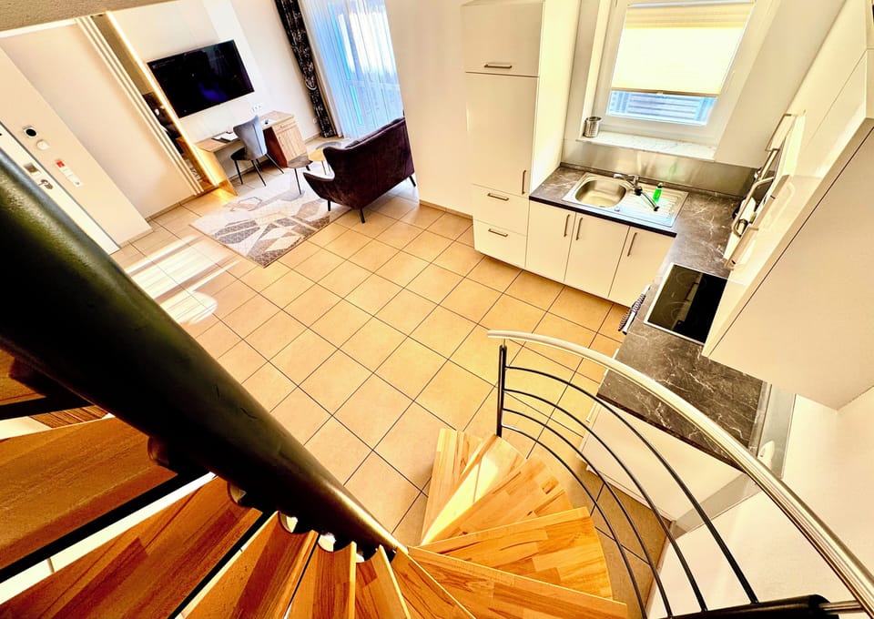 Suite Apartment | Living area | 55-inch flat-screen TV with digital channels, TV