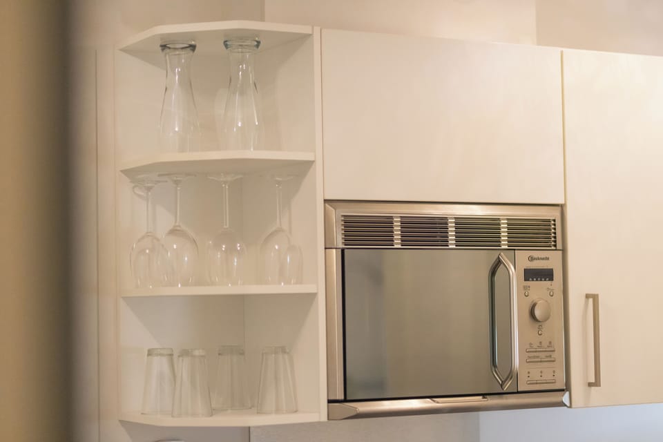 Comfort Apartment B | Private kitchen | Full-size fridge, microwave, coffee/tea maker, electric kettle