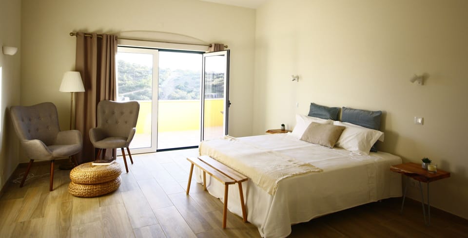 Hypo-allergenic bedding, laptop workspace, blackout drapes