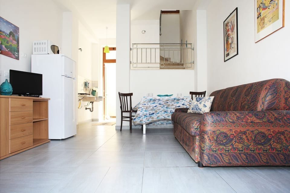 Apartment, 1 Bedroom | Living area | Flat-screen TV