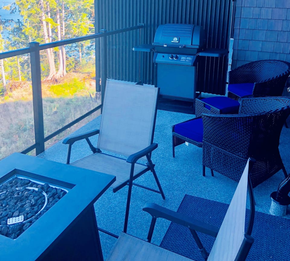 Patio also contains 4 extra chairs and a fire table