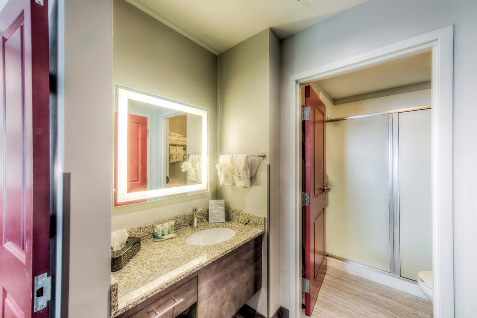 Get ready for the day in the modern and bright bathroom.