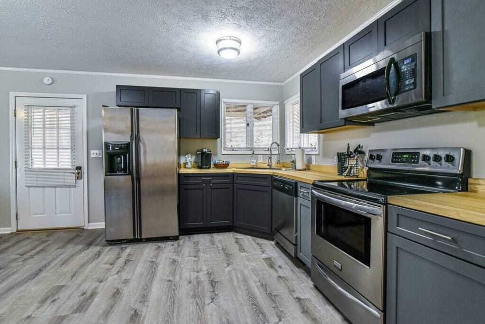 Full kitchen with stainless steel appliances