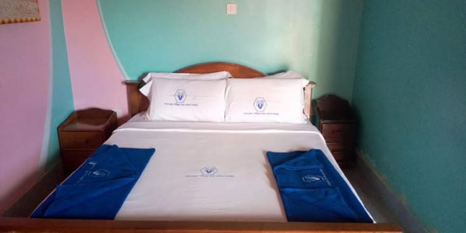 Deluxe Single Room | Memory foam beds, desk, blackout drapes, iron/ironing board