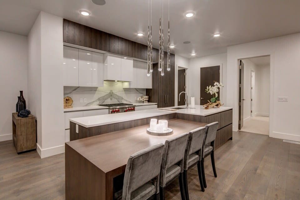 Kitchen with Wolf appliances, breakfast bar seating
