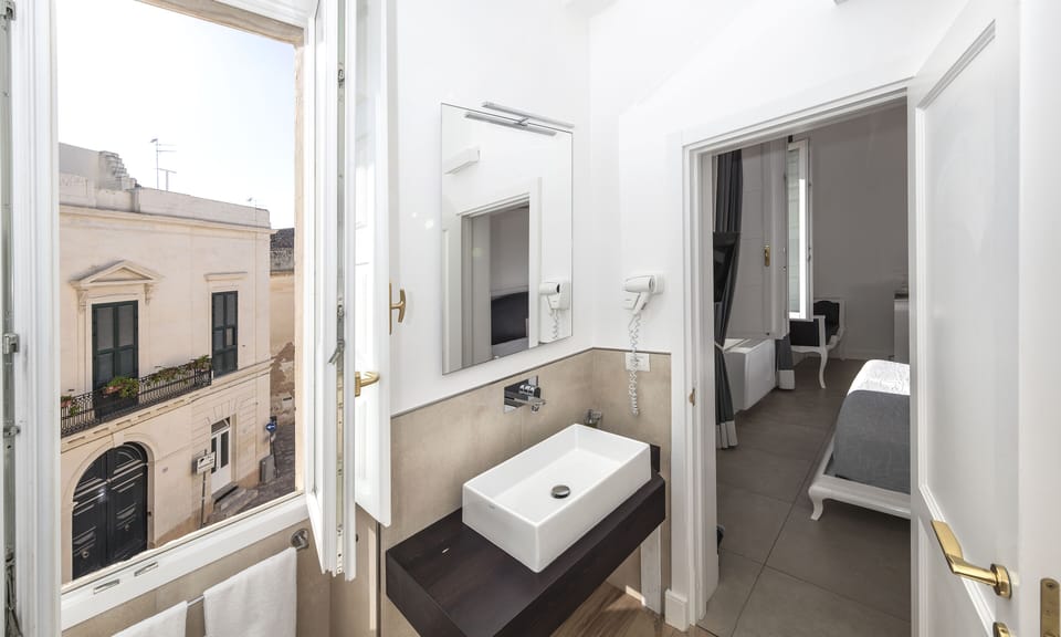 Double Room, City View (Liberty) | Bathroom | Shower, rainfall showerhead, free toiletries, hair dryer