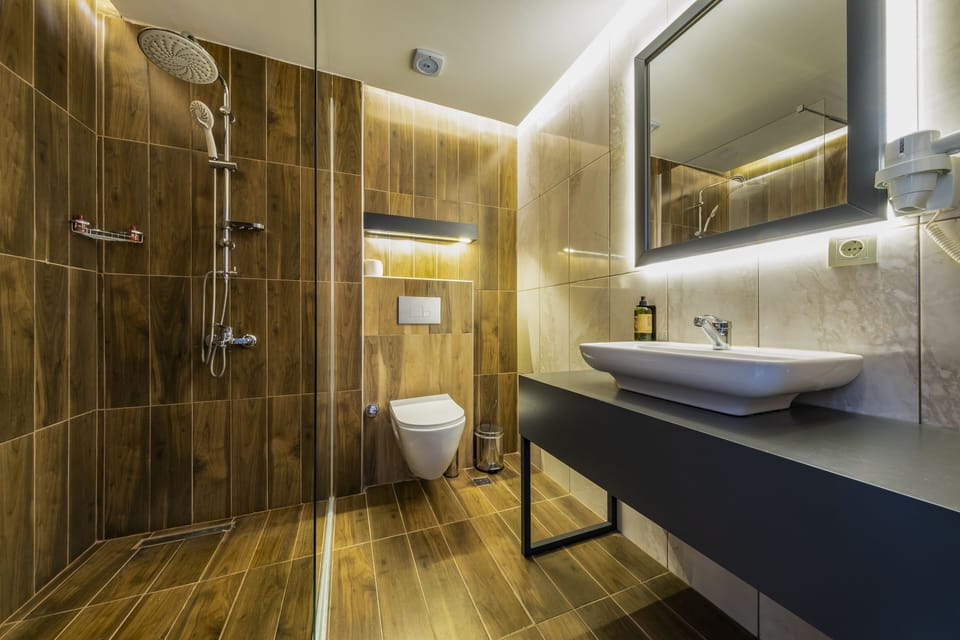 Shower, rainfall showerhead, designer toiletries, hair dryer