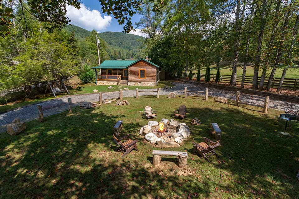 large circular driveway with a large fire pit in the middle