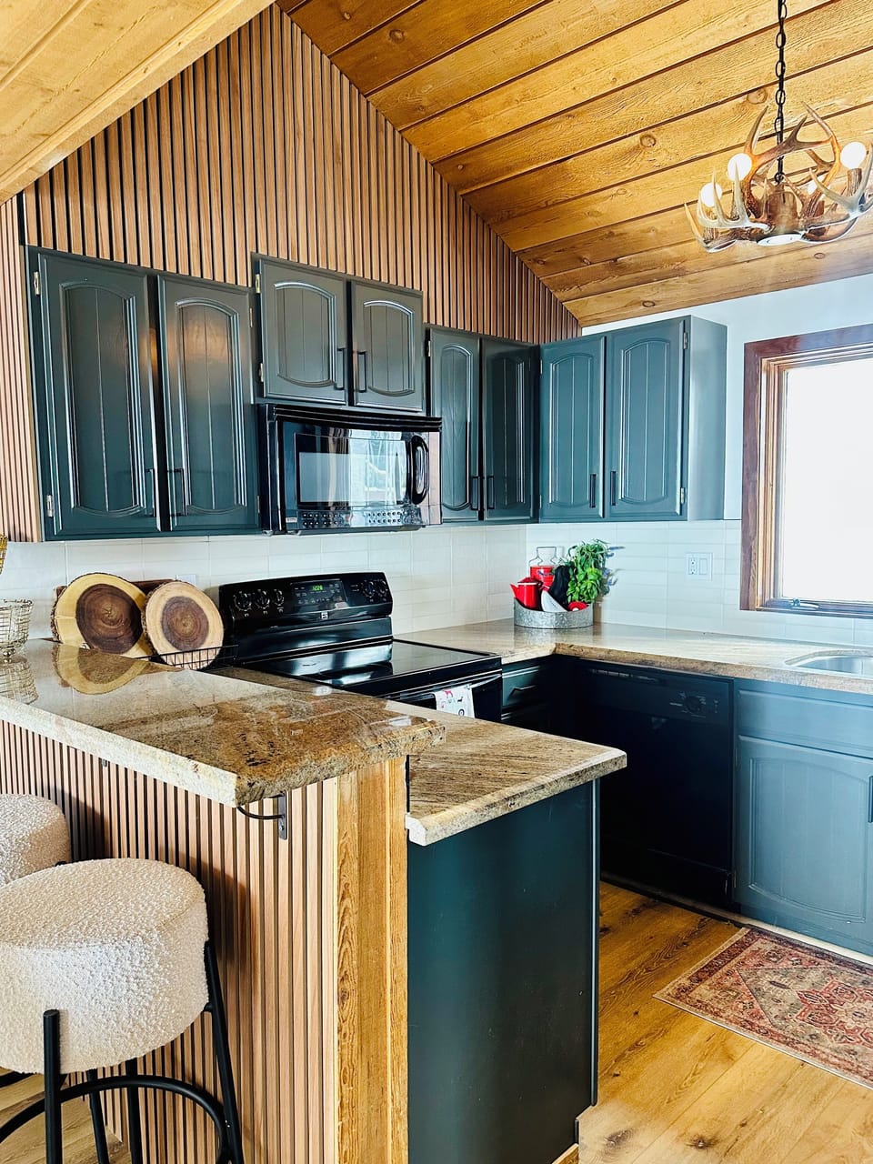Vintage Cedar ceilings and warm woods create a hip space for meal prep! 