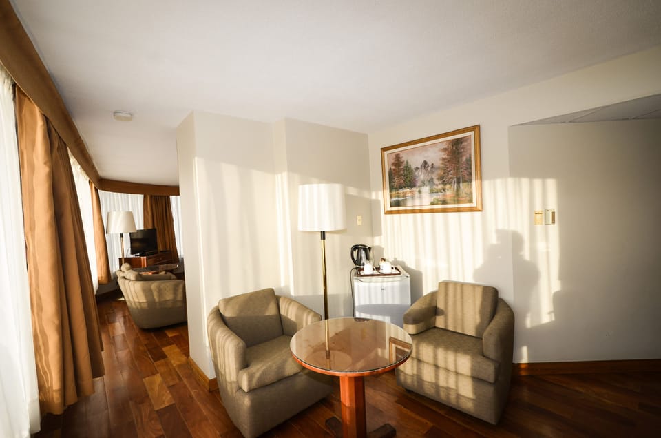 Standard Twin Room, 2 Double Beds | Living room | 32-inch LED TV with cable channels, TV