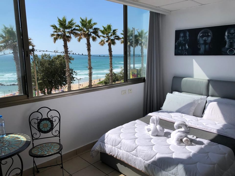 Classic Studio, Sea View | Down comforters, minibar, desk, iron/ironing board