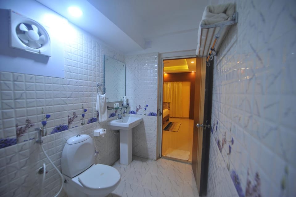 Shower, free toiletries, slippers, towels