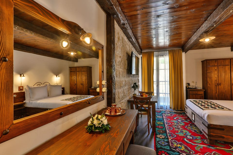 Family Studio Suite | Minibar, in-room safe, desk, laptop workspace