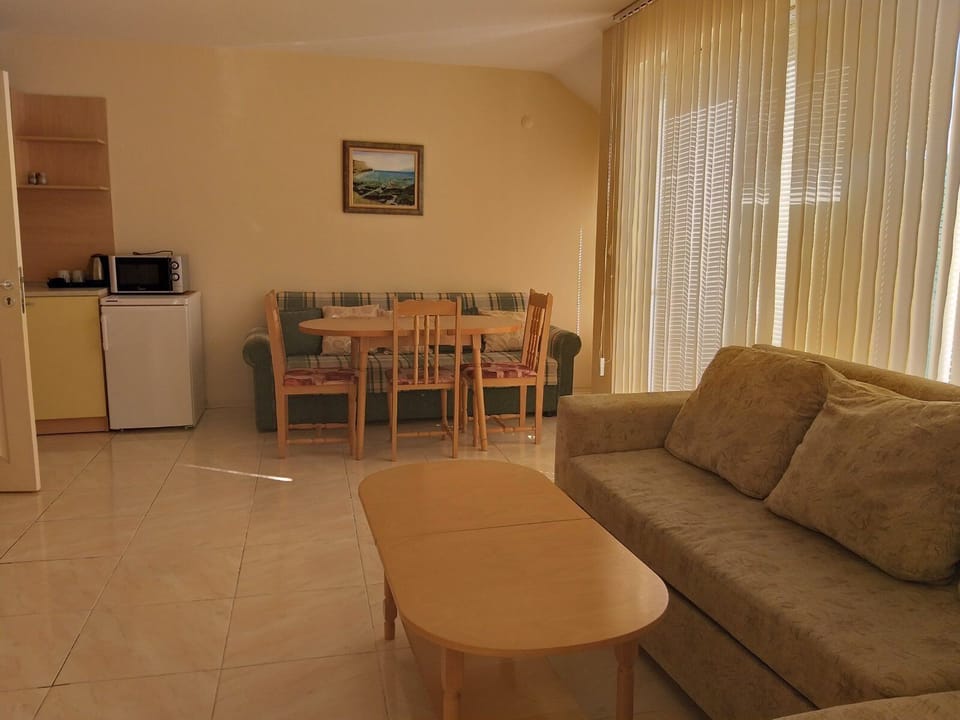 Family Apartment, 2 Bedrooms, Balcony, Park View | Living area | 32-inch flat-screen TV with cable channels, TV