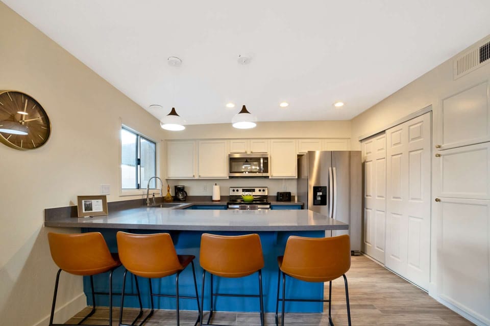 Kitchen with microwave, stove/oven, fridge, dishwasher, utensils etc