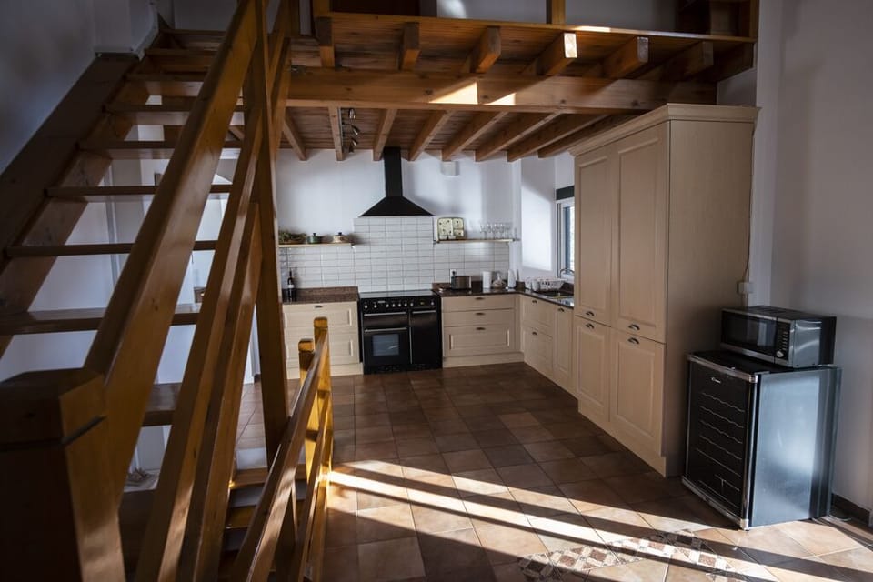Large fully equipped kitchen. Stairs leading up to bedroom 3