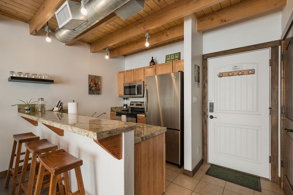 Kitchen fully stocked with kitchenware.