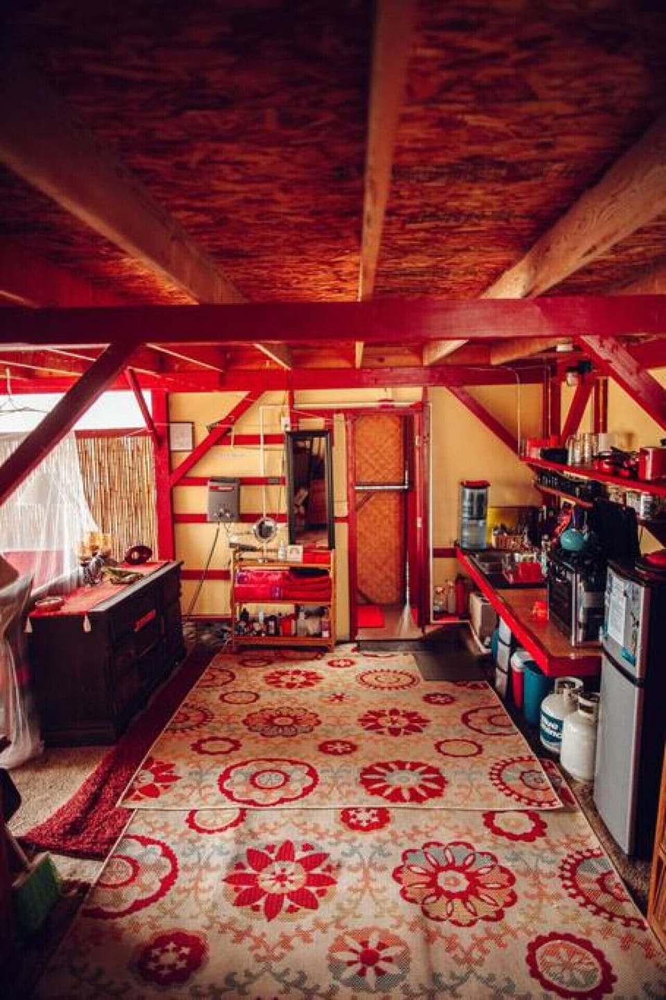 View from the stairs, looking into the kitchen and bathroom door ~