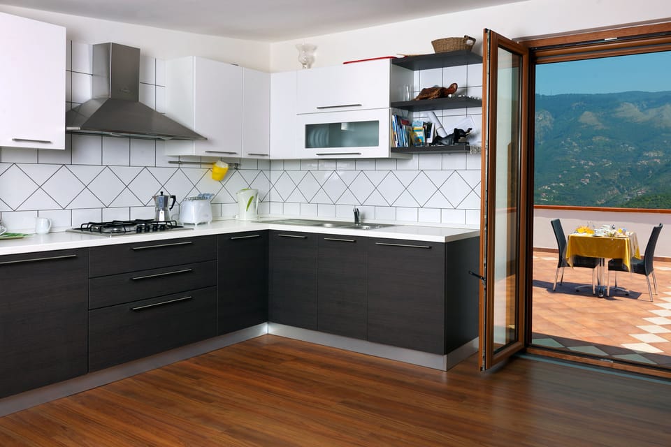 Triple Room | Private kitchen | Full-size fridge, coffee/tea maker, cookware/dishes/utensils