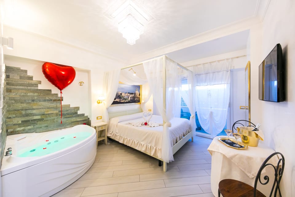 Deluxe Suite, Jetted Tub | Minibar, in-room safe, desk, soundproofing
