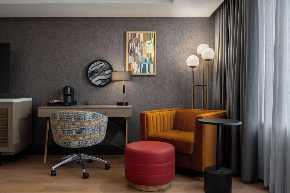 Premium bedding, desk, laptop workspace, blackout drapes