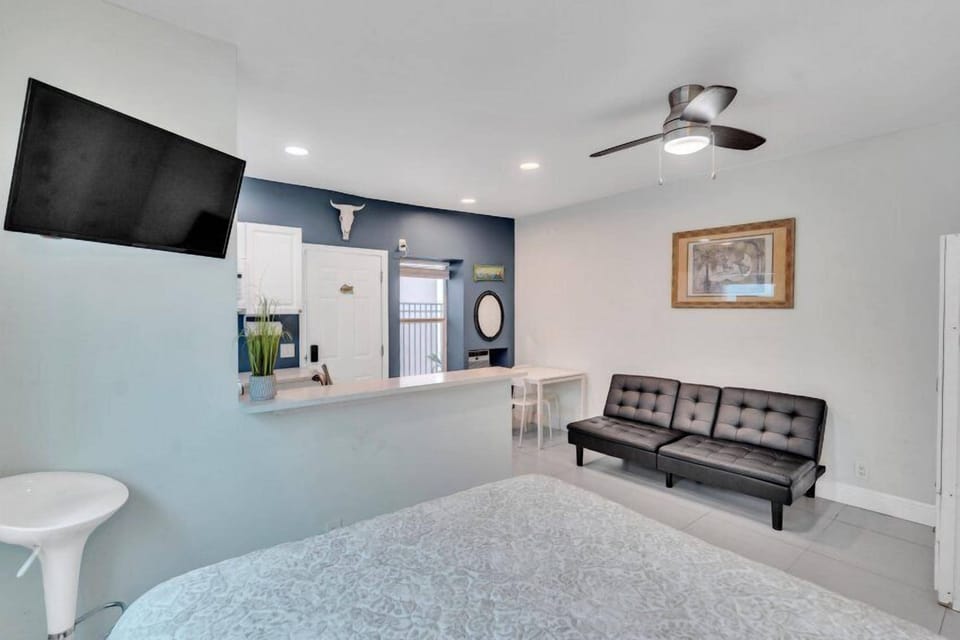 #4 = Seahorse Hideaway = 1 bedroom w/ queen sized bed and a futon couch | Living area | TV