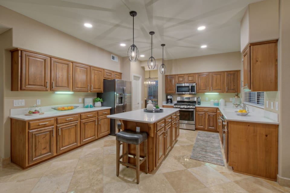 Large kitchen is well stocked and organized to make the chef and cooking crew happy.