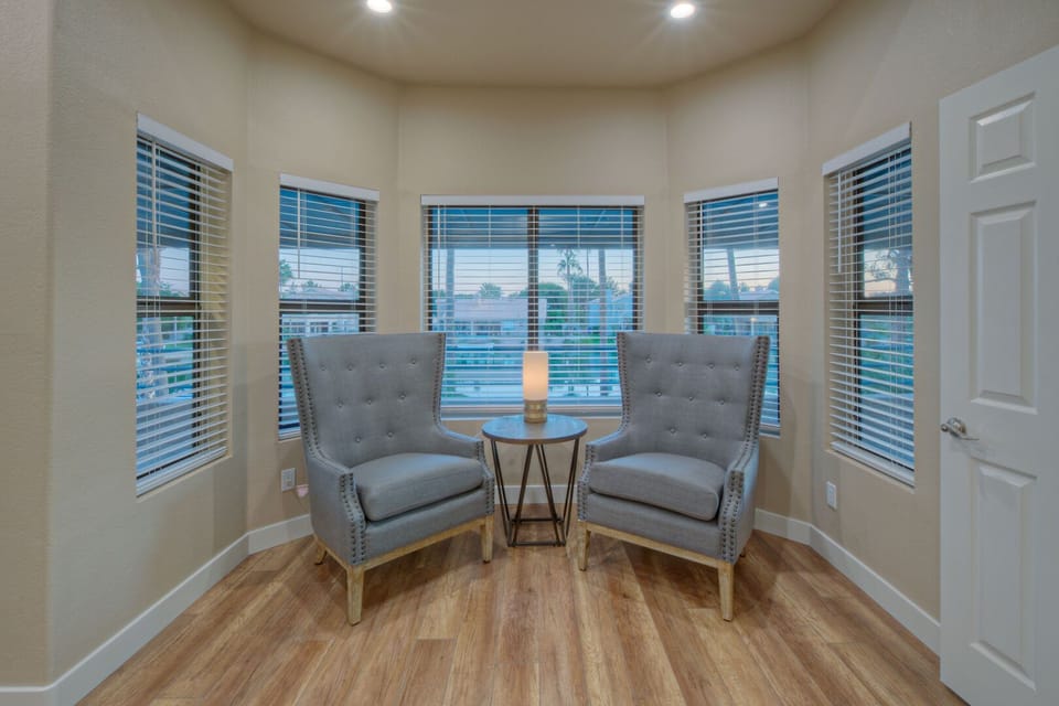Sitting area in the primary suite offers a secluded place to sip morning coffee or evening nightcaps.