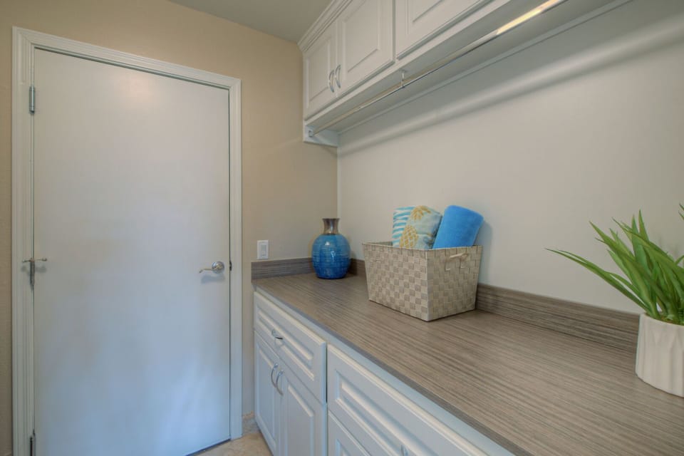 Well stocked laundry room includes a washer and dryer (not shown) that will help you keep your wardrobe ready for the next outing.
