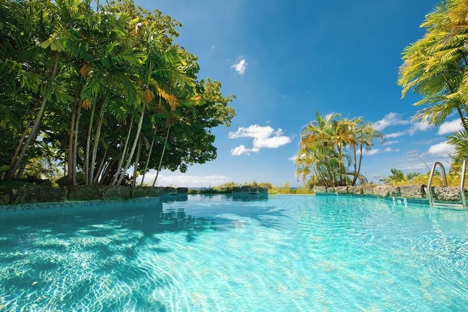 Ridge front swimming pool with ocean vistas and sundeck