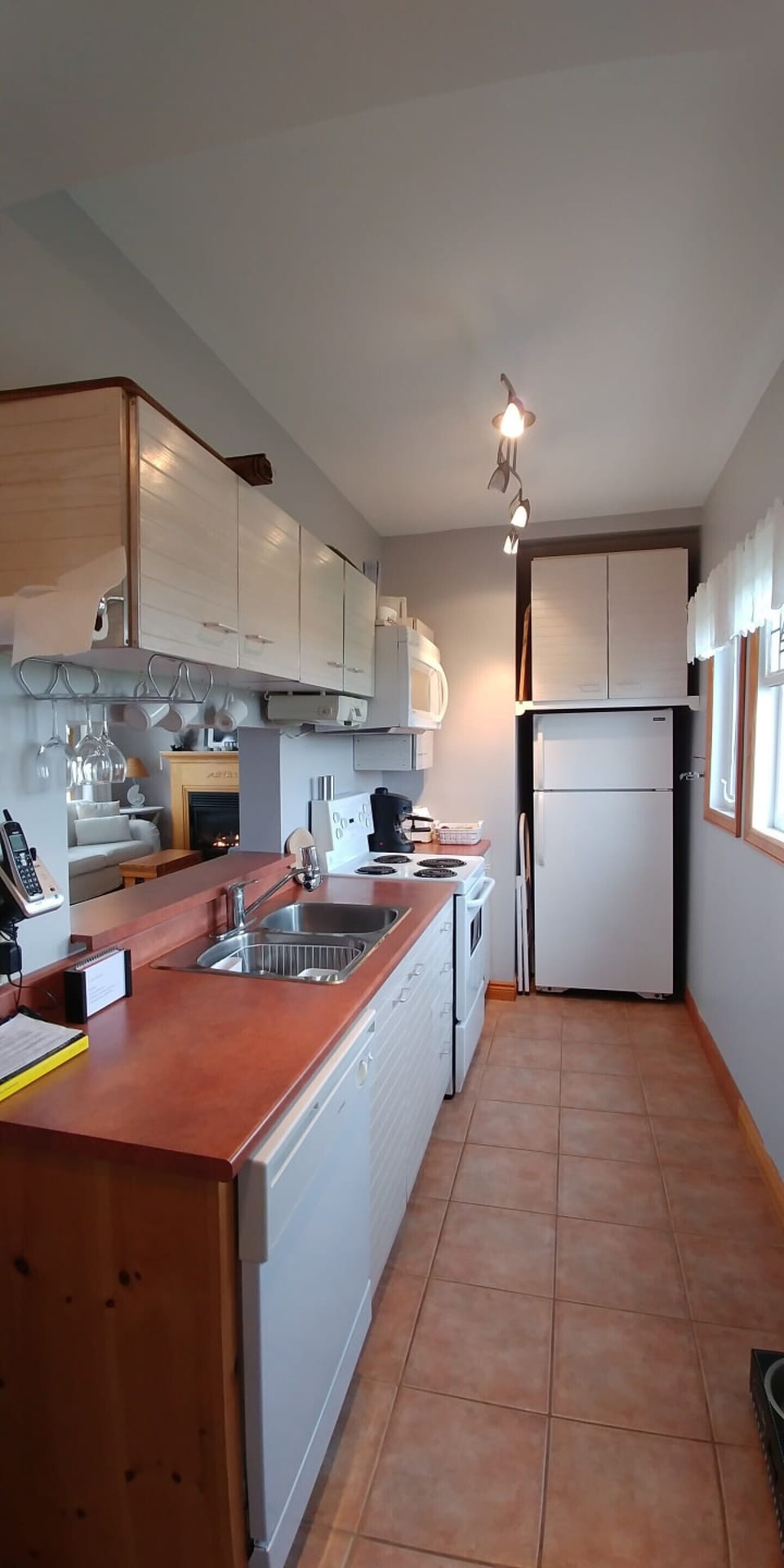 The galley kitchen has a washer/dryer at one end and all the features you need to feel at home.
