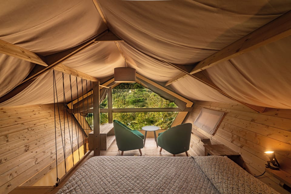 Deluxe Tent | Blackout drapes, bed sheets