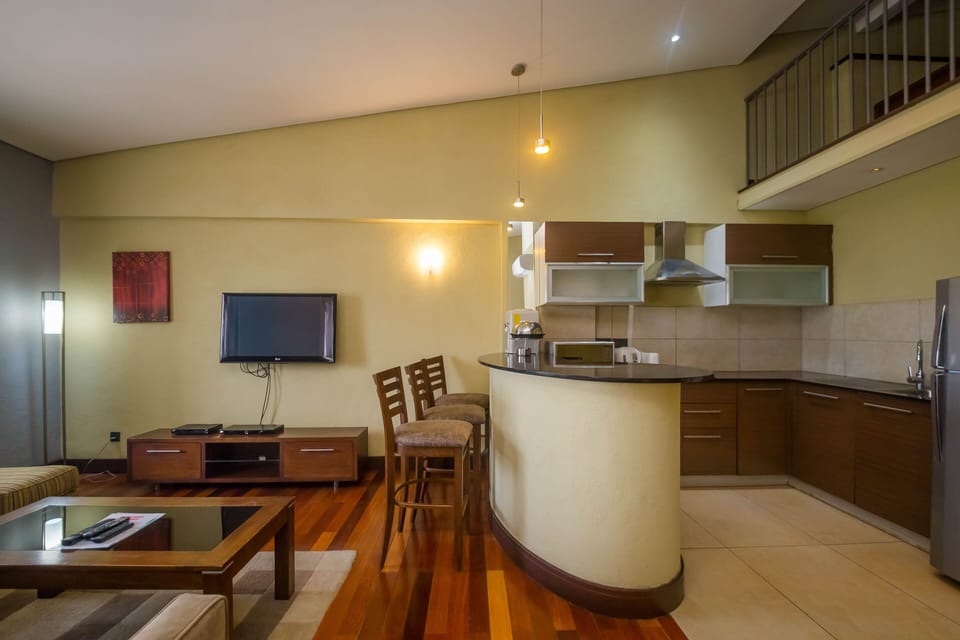 Premium Studio | Living area | 42-inch flat-screen TV with cable channels, TV, DVD player
