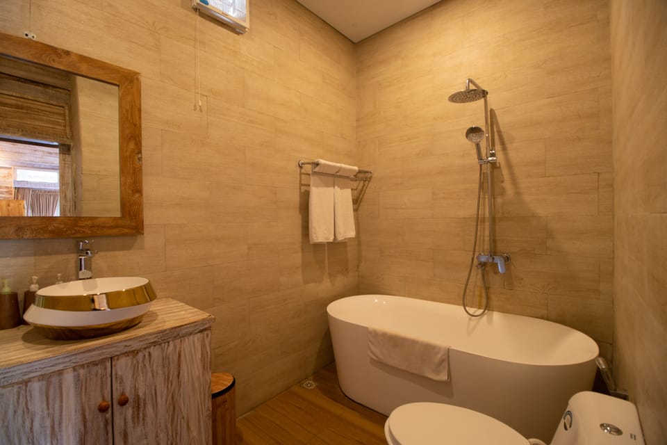 Separate tub and shower, rainfall showerhead, free toiletries