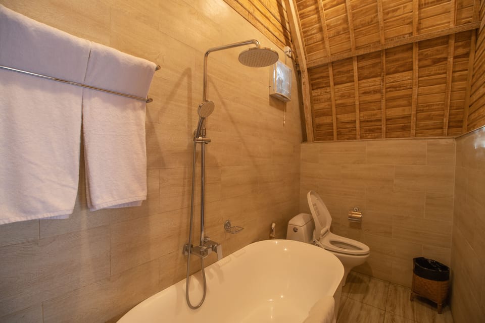 Deluxe Villa, 1 Bedroom, Non Smoking, Garden View | Bathroom | Separate tub and shower, rainfall showerhead, free toiletries
