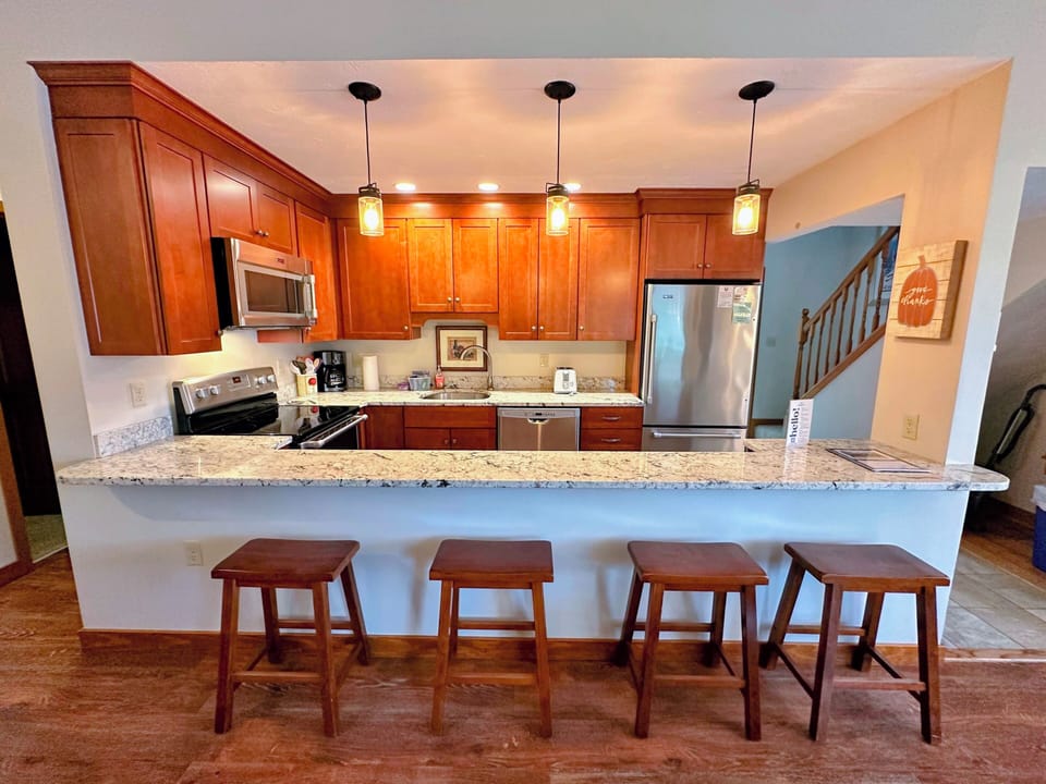 The updated kitchen has granite countertops and a nice open layout with lots of counter space and updated stainless steel appliances