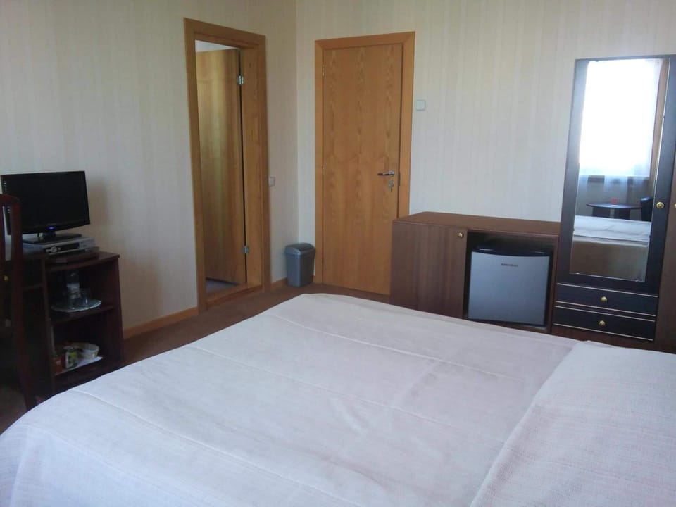 Desk, blackout drapes, soundproofing, iron/ironing board (on request)