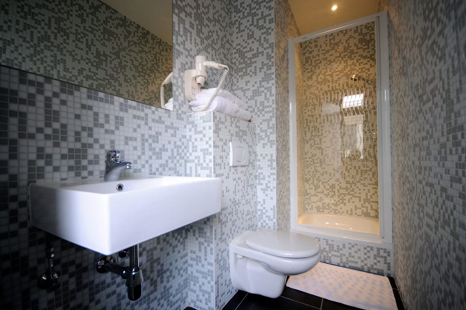 Shower, free toiletries, hair dryer, towels