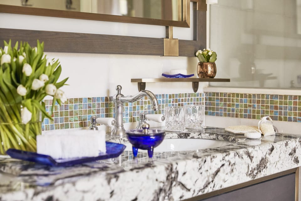 Separate tub and shower, designer toiletries, hair dryer, bathrobes