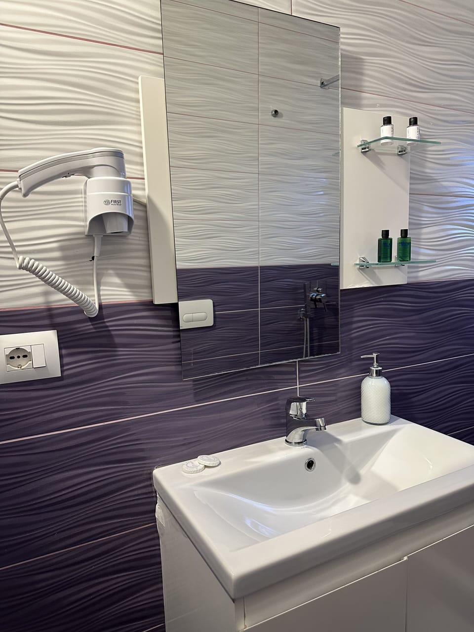 Shower, free toiletries, hair dryer, slippers
